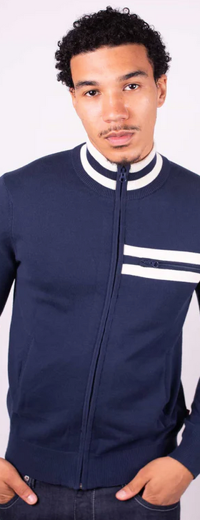 A man wearing a tight fitted navy blue zip up by Merc