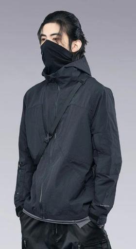 A man wearing a clotechnow black outfit featuring a black mask and technical jacket