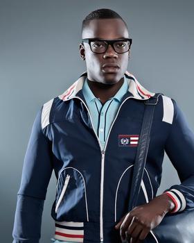 A man wearing a PHAT FARM zip up and a modern blue button up