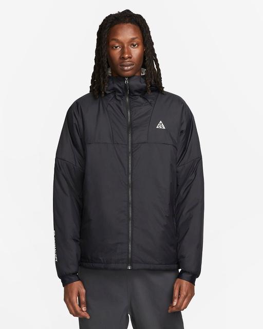 A man wearing a Nike ACG black jacket