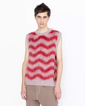 A man wearing a Highsnobiety striped pink and red vest in alpaca