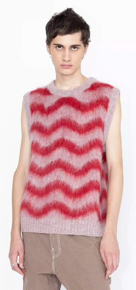 A man wearing a Highsnobiety striped pink and red vest in alpaca