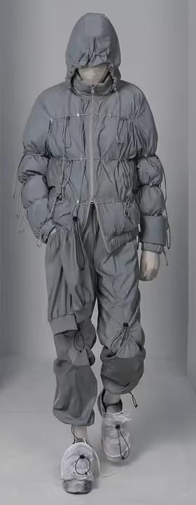 A man wearing a futuristic Post Archive Fashion technical outfit