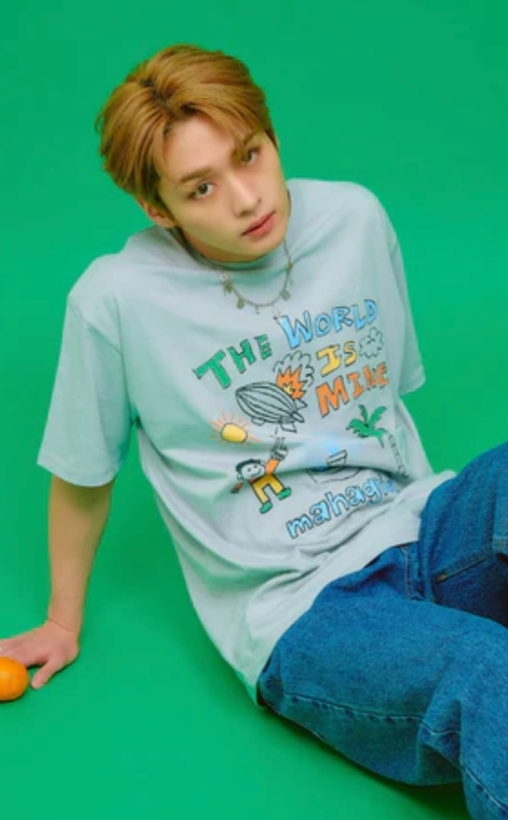 A man wearing a blue cartoon shirt by Mahagrid