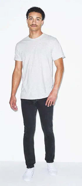 A man wearing a simple white t-shirt and tight black pants by American Apparel