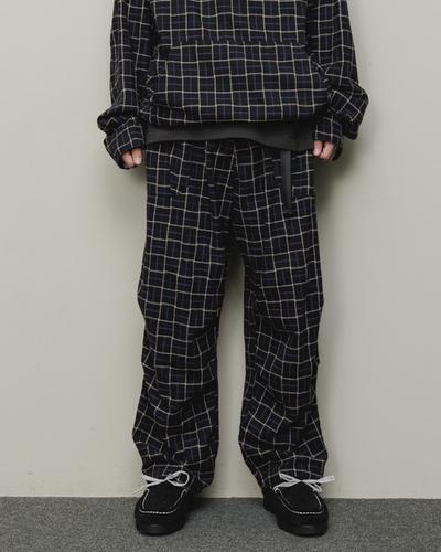 A man wearing a checkered baloriginal matching jacket and pants