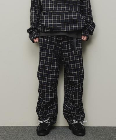 A man wearing a checkered baloriginal matching jacket and pants