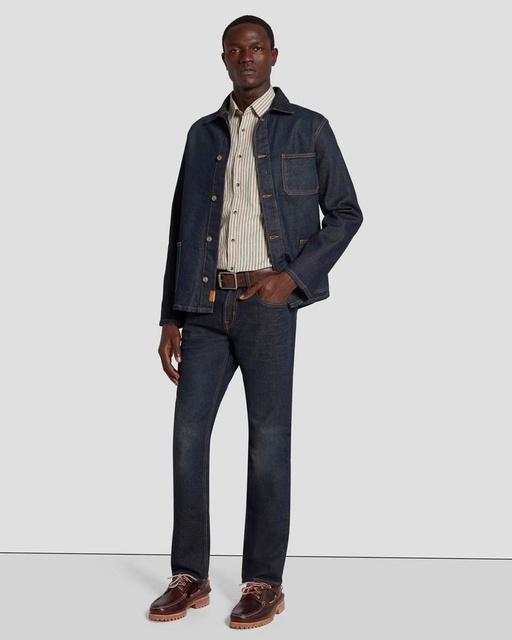 A man wearing 7 of All Mankind denim pants and matching jacket