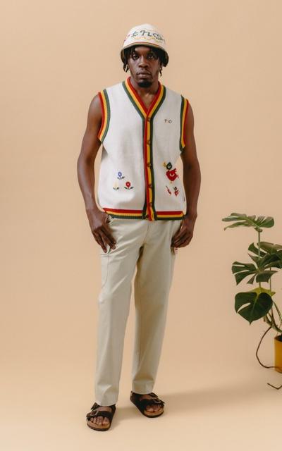 A man wearing a floral vest by The New Originals Amsterdam