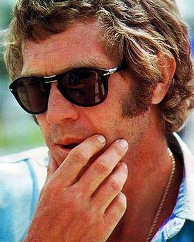A man wearing a classic pair of Persol sunglasses