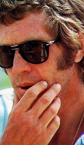 A man wearing a classic pair of Persol sunglasses