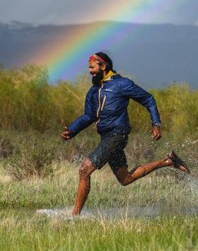 A man wearing a pair of Bedrock Sandals running