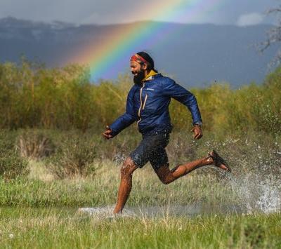 A man wearing a pair of Bedrock Sandals running