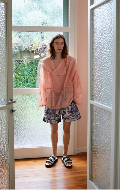 A woman wearing Suicoke blue velcro slippers