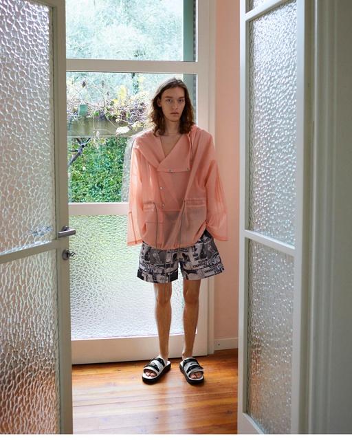 A woman wearing Suicoke blue velcro slippers