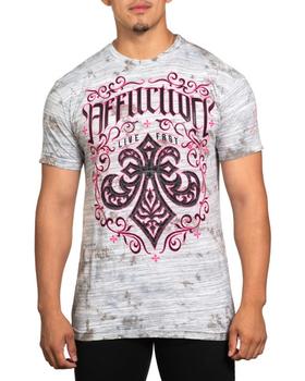 A man wearing an affliction t-shirt in pink and grey