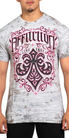 A man wearing an affliction t-shirt in pink and grey