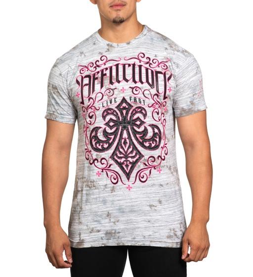 A man wearing an affliction t-shirt in pink and grey