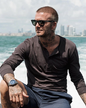 David Beckham wearing a pair of black classic Ray Ban sunglasses