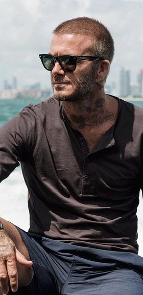 David Beckham wearing a pair of black classic Ray Ban sunglasses