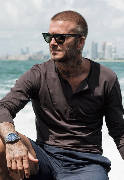 David Beckham wearing a pair of black classic Ray Ban sunglasses