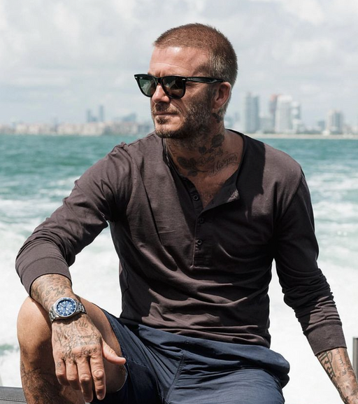 David Beckham wearing a pair of black classic Ray Ban sunglasses