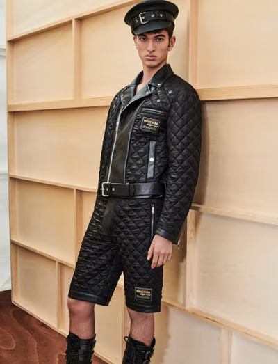 A man wearing a Moschino all black leather outfit