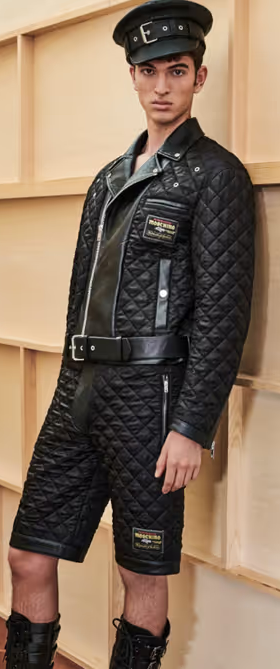 A man wearing a Moschino all black leather outfit