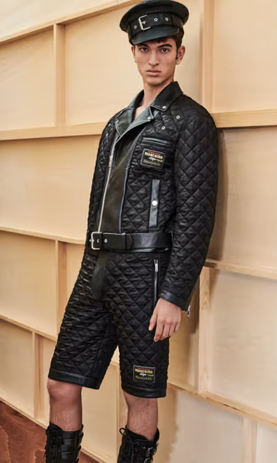 A man wearing a Moschino all black leather outfit