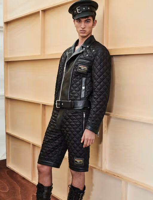 A man wearing a Moschino all black leather outfit