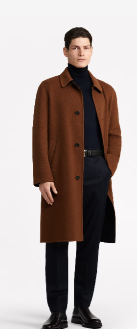 A man wearing a brown Dunhill overcoat with a black turtleneck