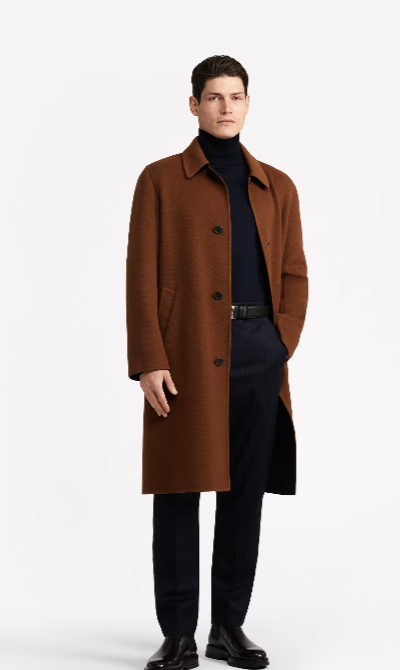 A man wearing a brown Dunhill overcoat with a black turtleneck