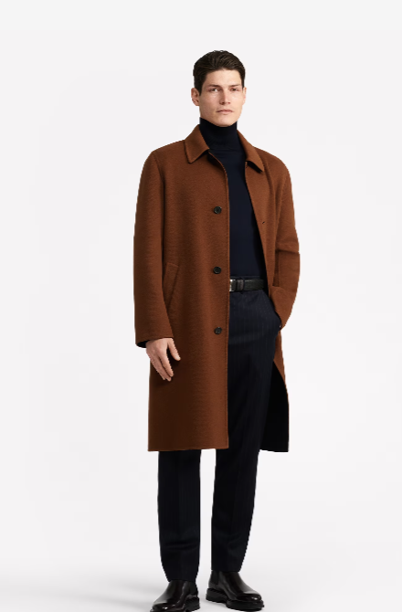 A man wearing a brown Dunhill overcoat with a black turtleneck