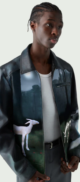 A man wearing a Coperni leather jacket with deer images on it