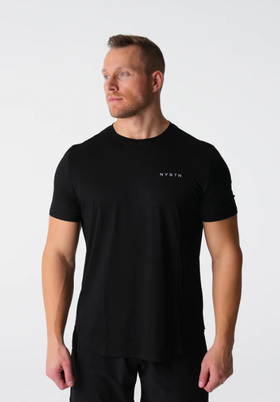 A man wearing a tight-fitting black NVGTN logo t-shirt