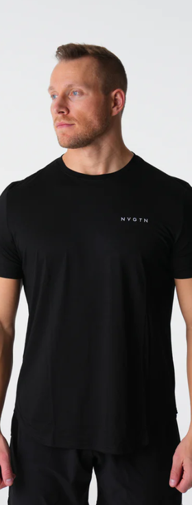 A man wearing a tight-fitting black NVGTN logo t-shirt