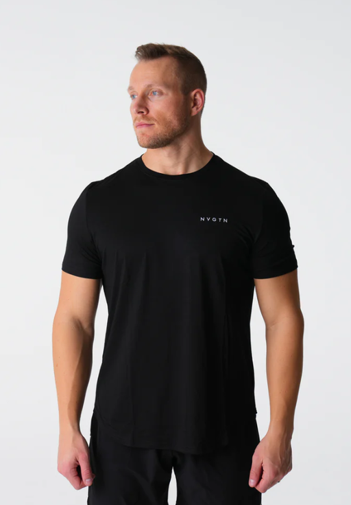 A man wearing a tight-fitting black NVGTN logo t-shirt