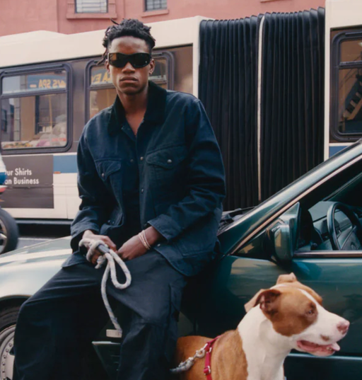 A man wearing a pair of black Port Tanger sunglasses