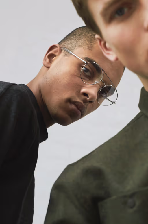 A man wearing a pair of RetroSuperFuture clear silver eyeglasses