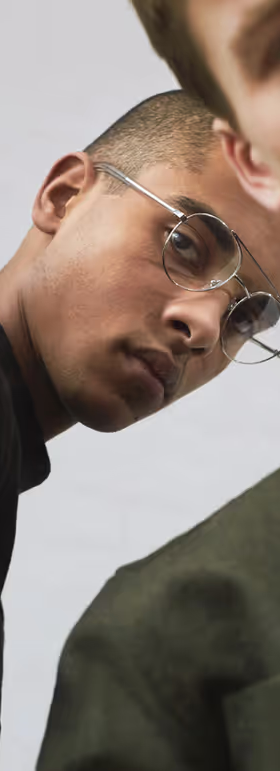 A man wearing a pair of RetroSuperFuture clear silver eyeglasses