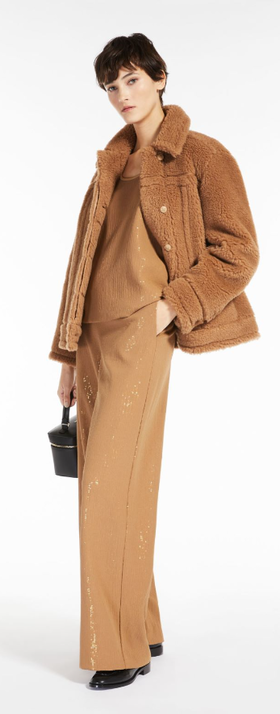 A woman wearing an all brown Max Brown outfit with a fleece overcoat
