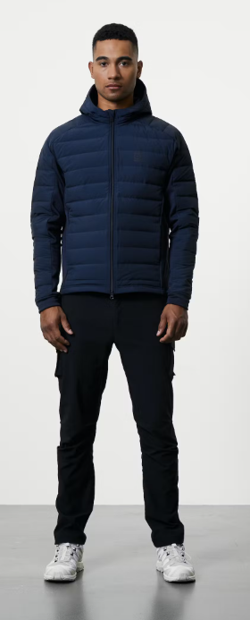 A man wearing a black 66°NORTH jacket and black pants