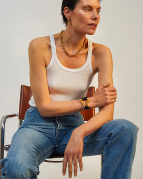 A woman wearing Alighieri gold jewelry