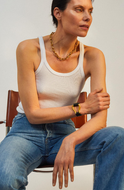 A woman wearing Alighieri gold jewelry