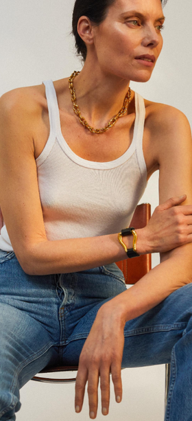 A woman wearing Alighieri gold jewelry