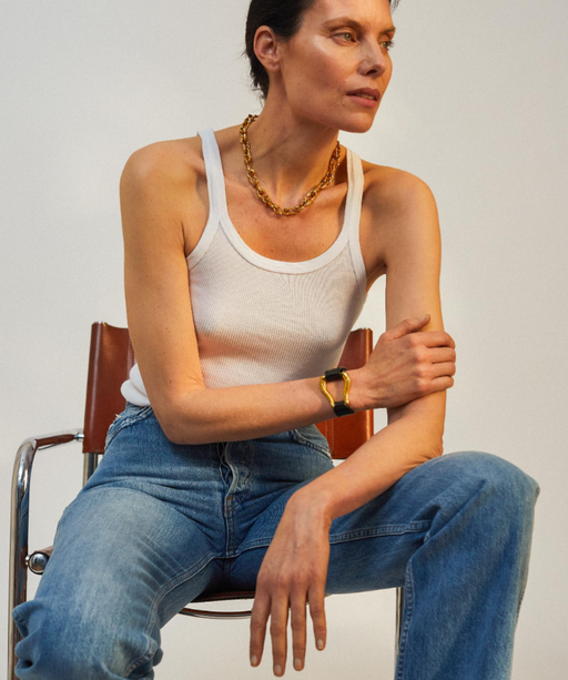 A woman wearing Alighieri gold jewelry