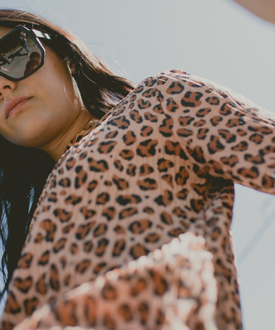 A woman wearing a pair of oversize Vonzipper sunglasses