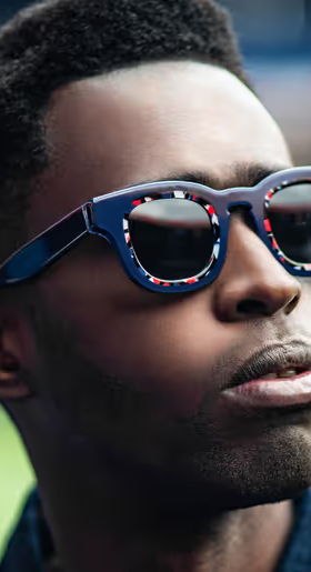 A man wearing a Thierry Lasry pair of colorful glasses