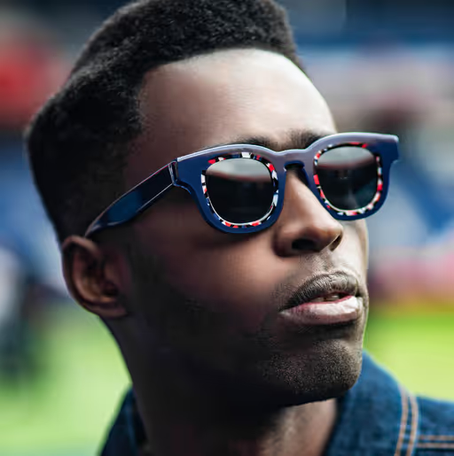 A man wearing a Thierry Lasry pair of colorful glasses