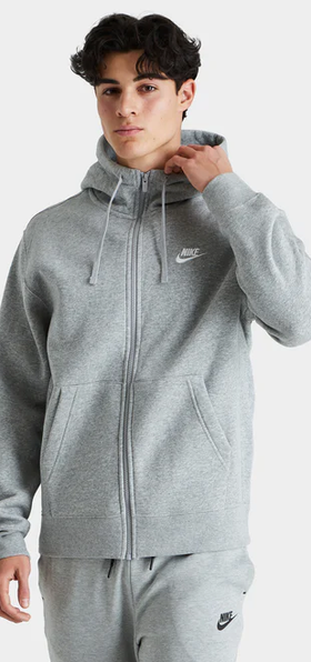 A man wearing a grey nike outfit from JD sports